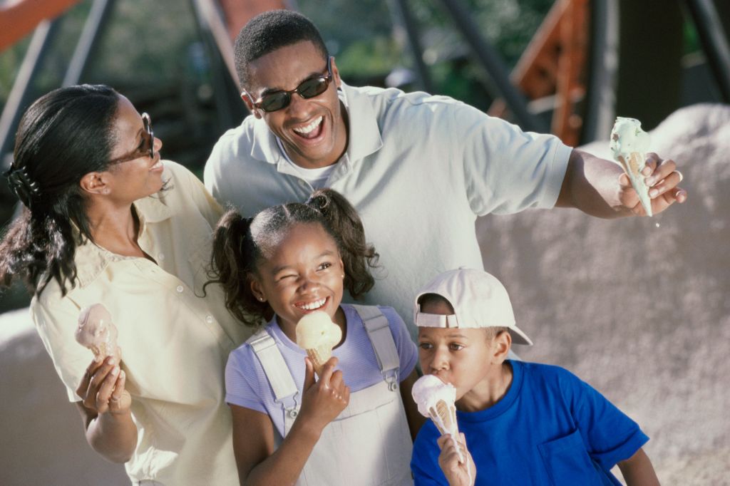 Parents and their two children eating ice cream cones