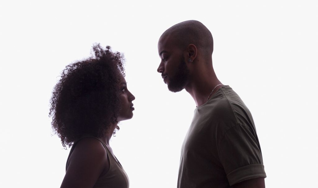 Silhouette of young couple in studio setting