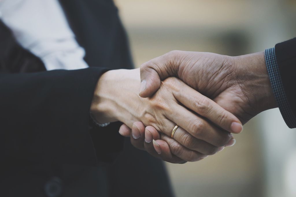 Close-Up Of People Doing Handshake
