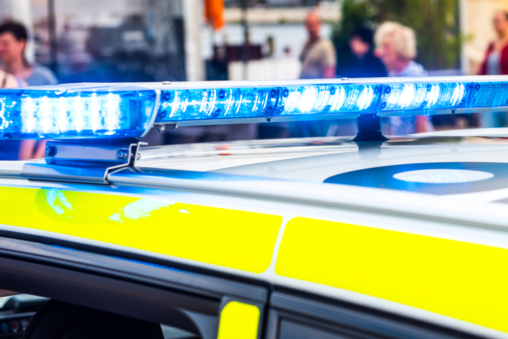 Close-Up Of Illuminated Police Car In City